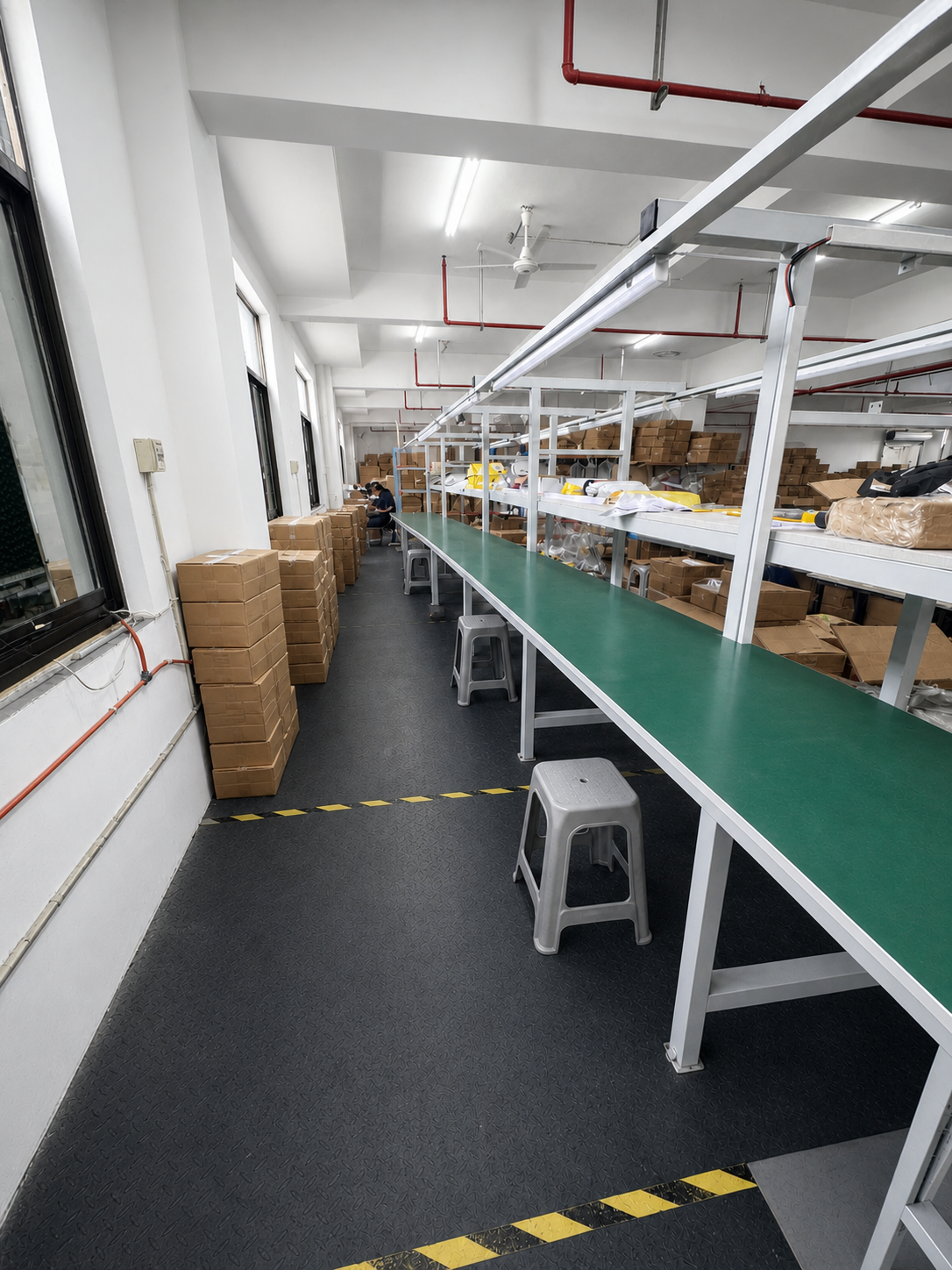 BENGGUO production line with organized workstations and stools in Yiwu, China